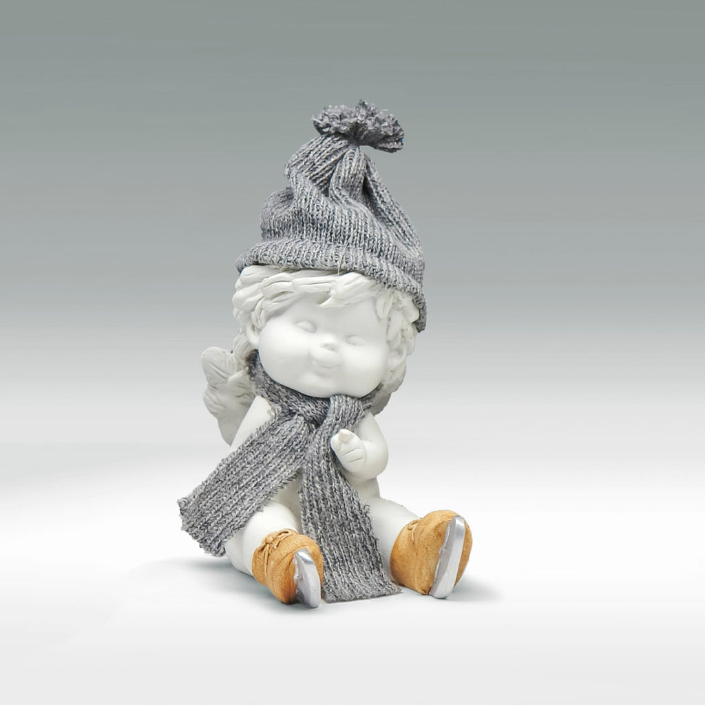 Winterengel Igor beim Wintersport Size M - sitzend am Eislaufen
